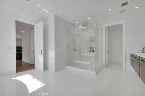 a kitchen with a refrigerator and a sink