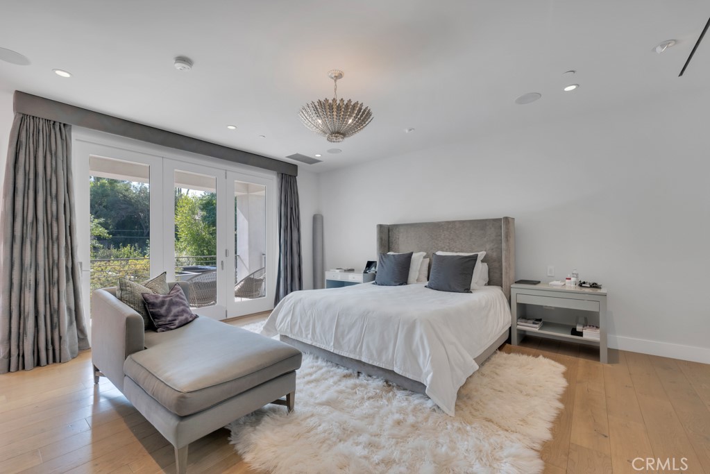 17950 Rancho Street Encino, CA 91316 - Photo 37 of 75 a bedroom with a bed and a couch