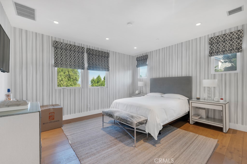 17950 Rancho Street Encino, CA 91316 - Photo 45 of 75 a bedroom with a bed and a window