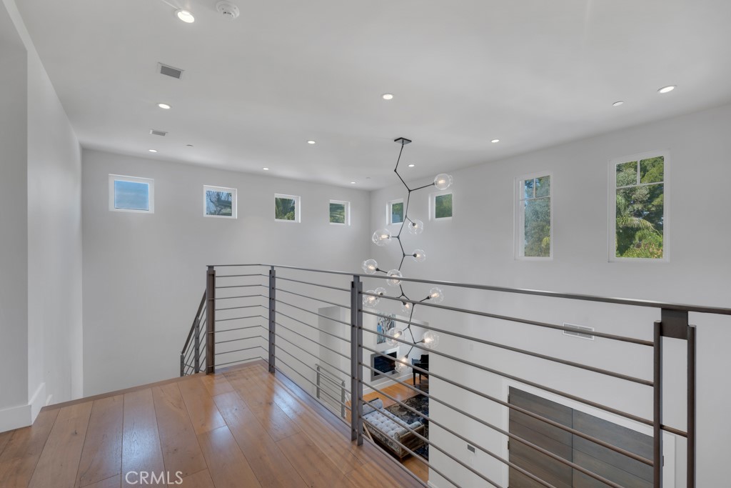 17950 Rancho Street Encino, CA 91316 - Photo 54 of 75 a view of a hallway with stairs