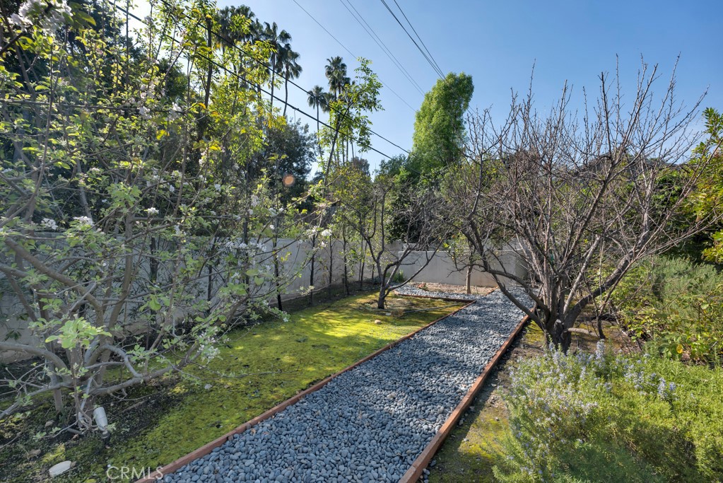 17950 Rancho Street Encino, CA 91316 - Photo 65 of 75 a view of a backyard with swimming pool