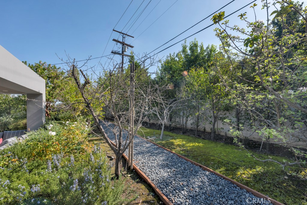 17950 Rancho Street Encino, CA 91316 - Photo 66 of 75 a view of a backyard with a small cabin