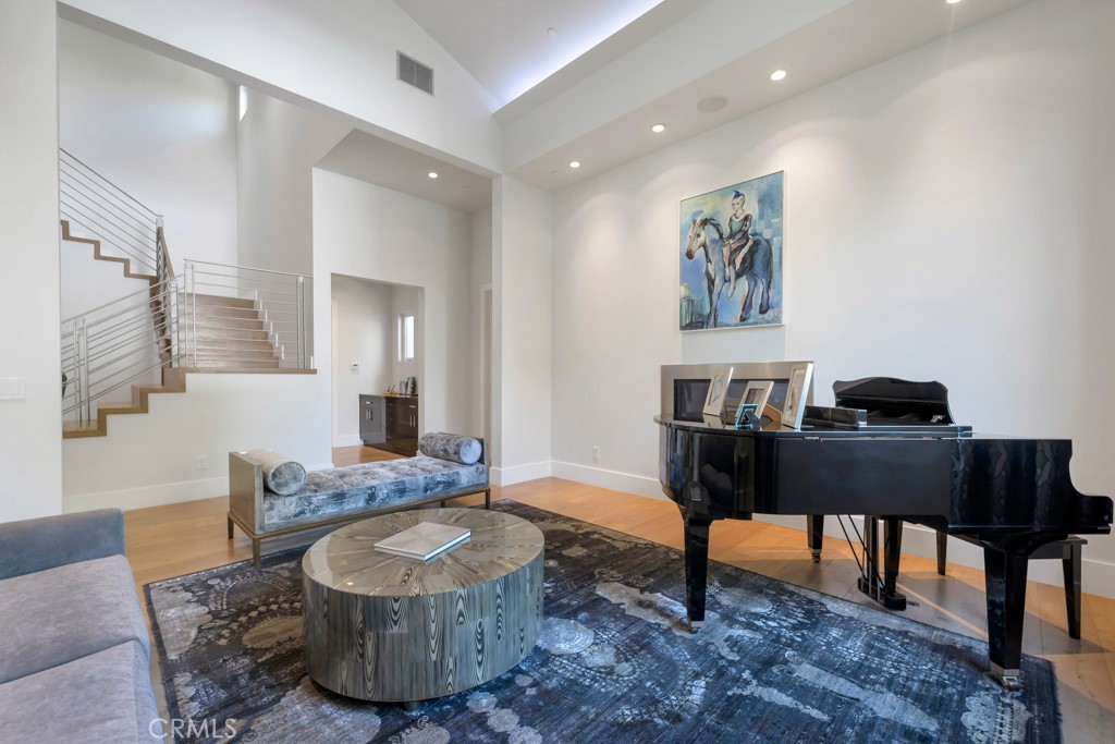 17950 Rancho Street Encino, CA 91316 - Photo 9 of 75 a living room with furniture and a wooden floor