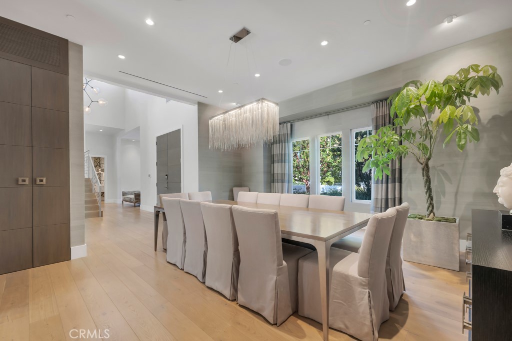 17950 Rancho Street Encino, CA 91316 - Photo 10 of 75 a dining room with furniture and a large window