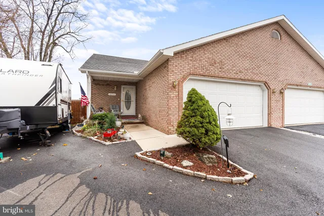 a front view of a house with yard