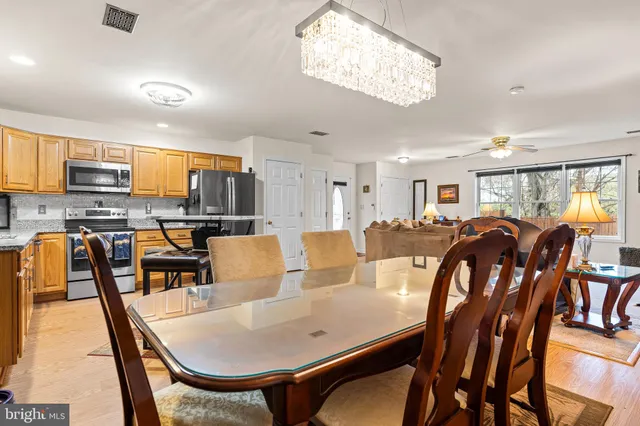 a view of kitchen with dining table and chairs