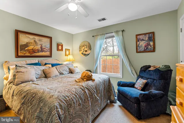 a bed room with a bed and a couch