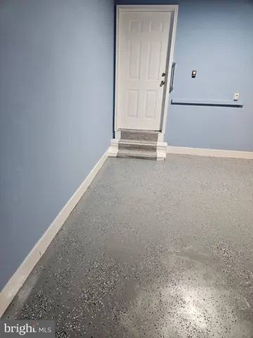 a front view of a house with a garden and pathway