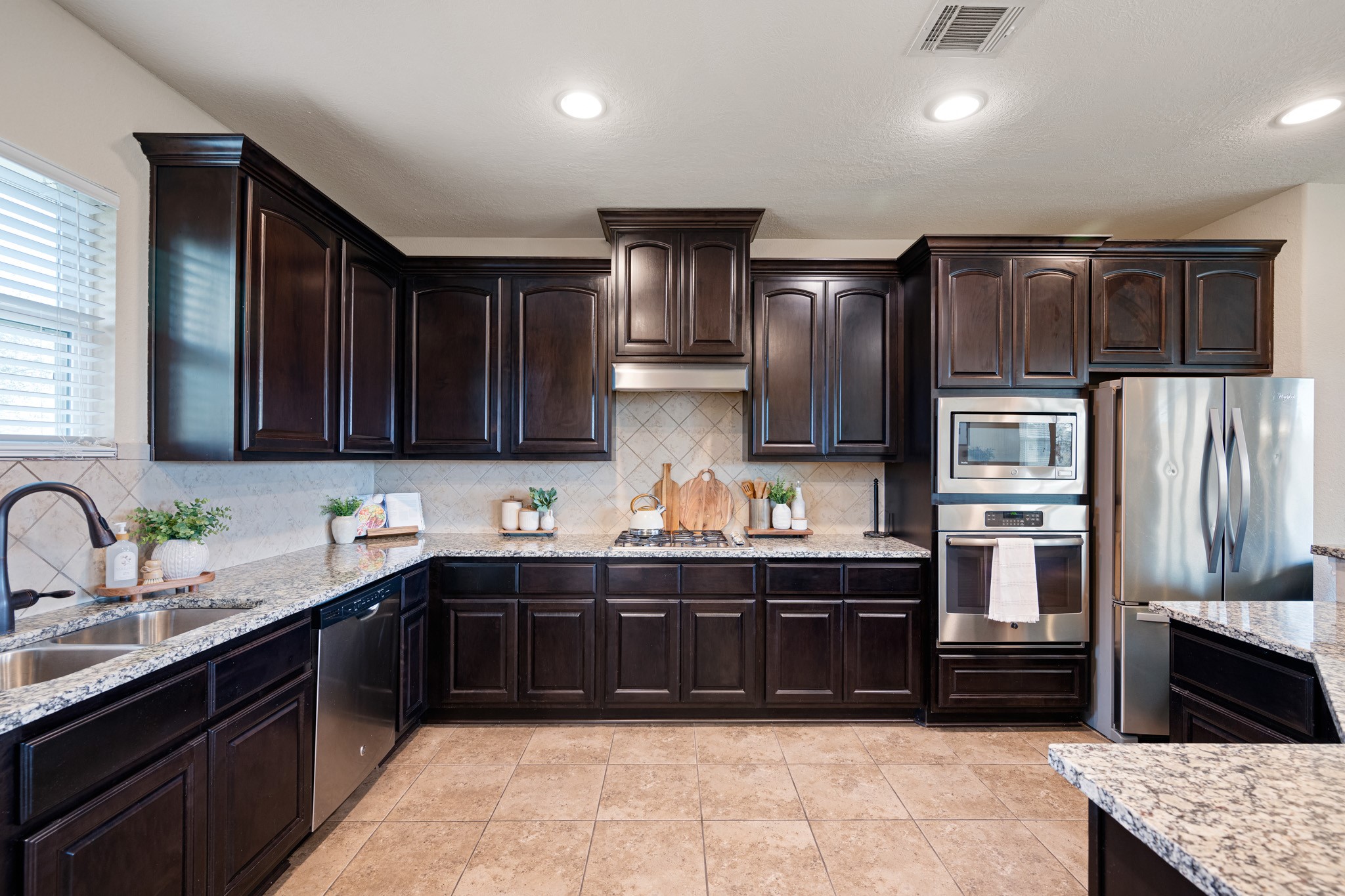8131 Brinkmeyer Road Needville, TX 77461 - Photo 14 of 34 There is not shortage of storage in this kitchen. Check out all of the cabinets!