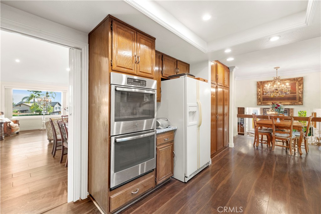 7125 Lonzo Street Tujunga, CA 91042 - Photo 18 of 66 a kitchen with a refrigerator a table and chairs