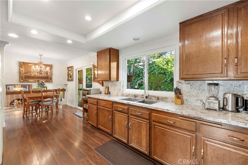 7125 Lonzo Street Tujunga, CA 91042 - Photo 19 of 66 a kitchen with lots of counter top space and dining table