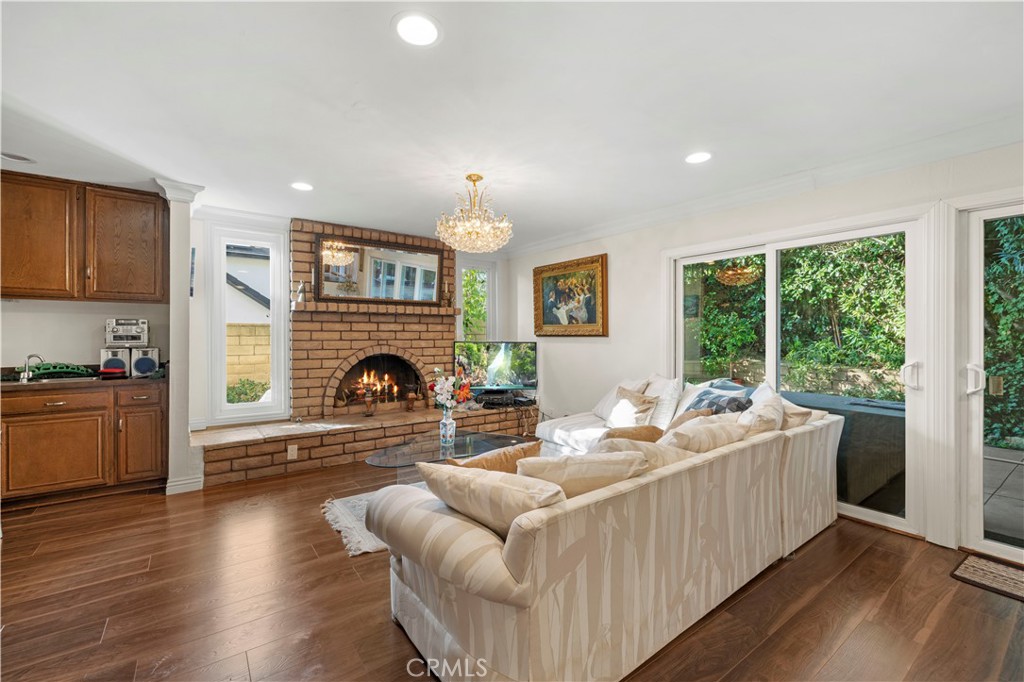 7125 Lonzo Street Tujunga, CA 91042 - Photo 21 of 66 a living room with furniture and a fireplace