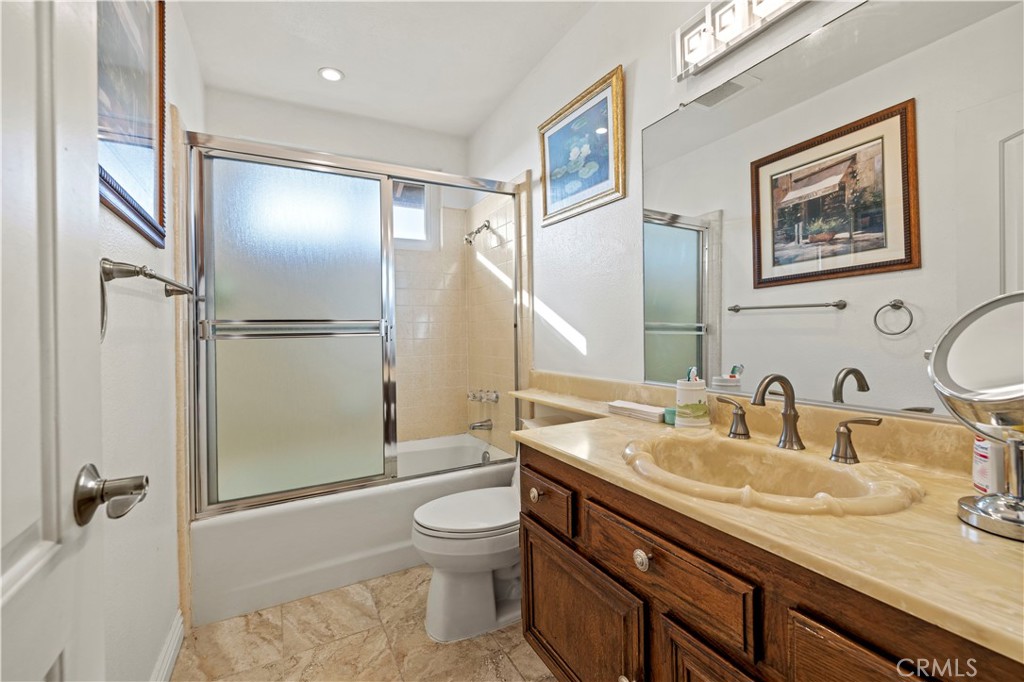 7125 Lonzo Street Tujunga, CA 91042 - Photo 27 of 66 a bathroom with a sink toilet and shower