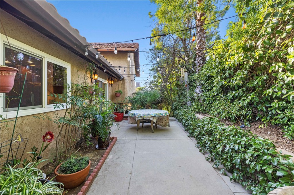 7125 Lonzo Street Tujunga, CA 91042 - Photo 50 of 66 a view of a patio with table and chairs and potted plants