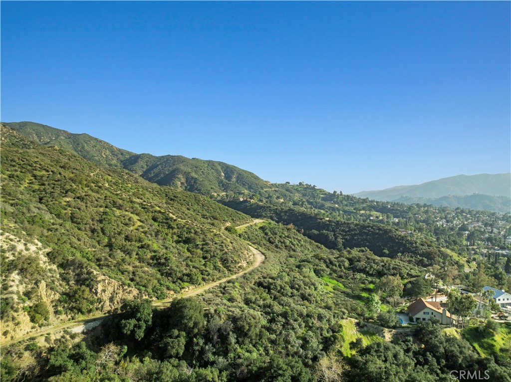 7125 Lonzo Street Tujunga, CA 91042 - Photo 62 of 66 a view of a mountain range with lush green forest