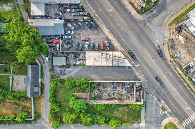 a aerial view of a house with yard swimming pool and outdoor seating
