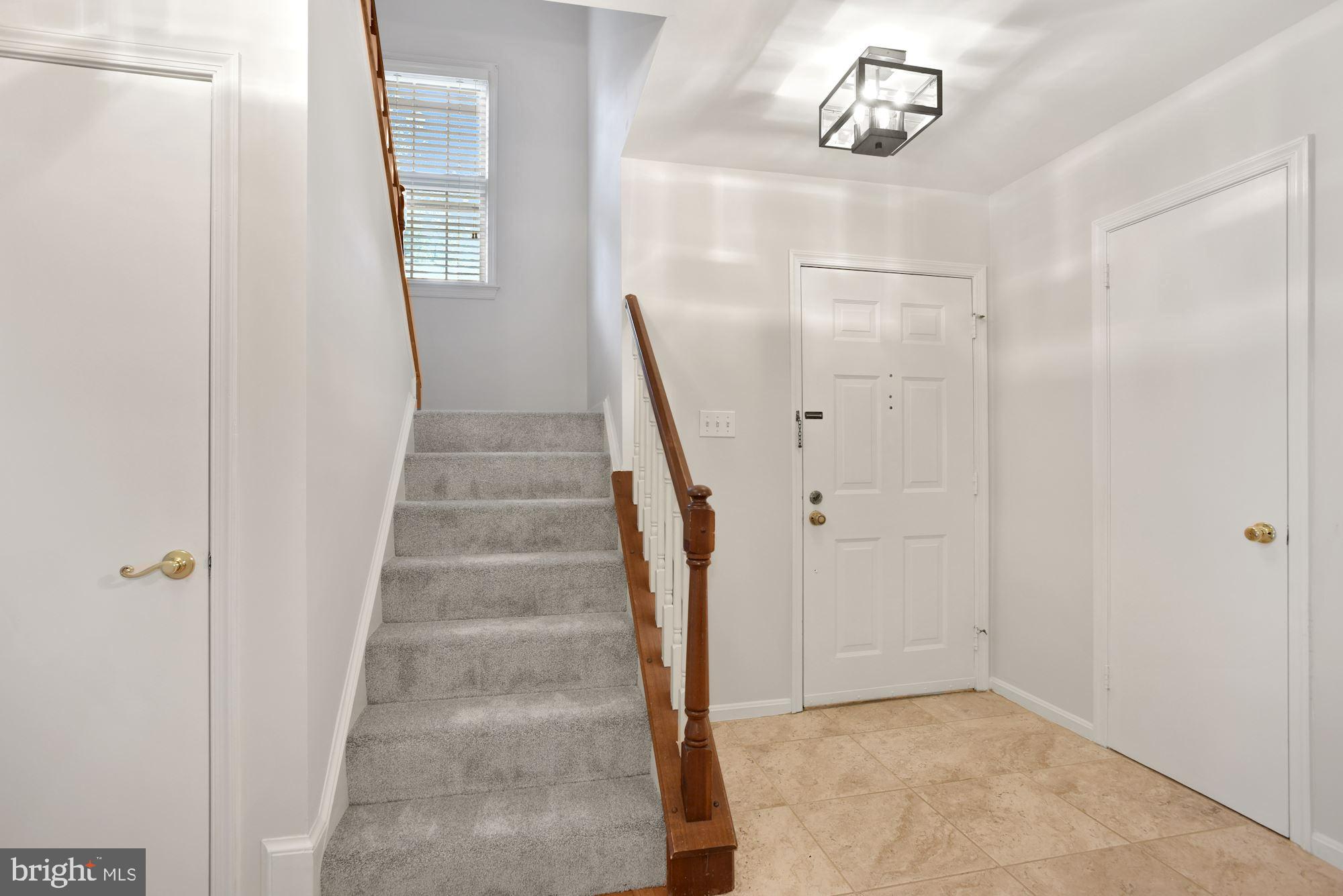 2263 Double Eagle Court Reston, VA 20191 - Photo 5 of 33 Front foyer. Newly carpeted stairs