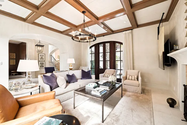 a kitchen with a refrigerator a sink and chairs