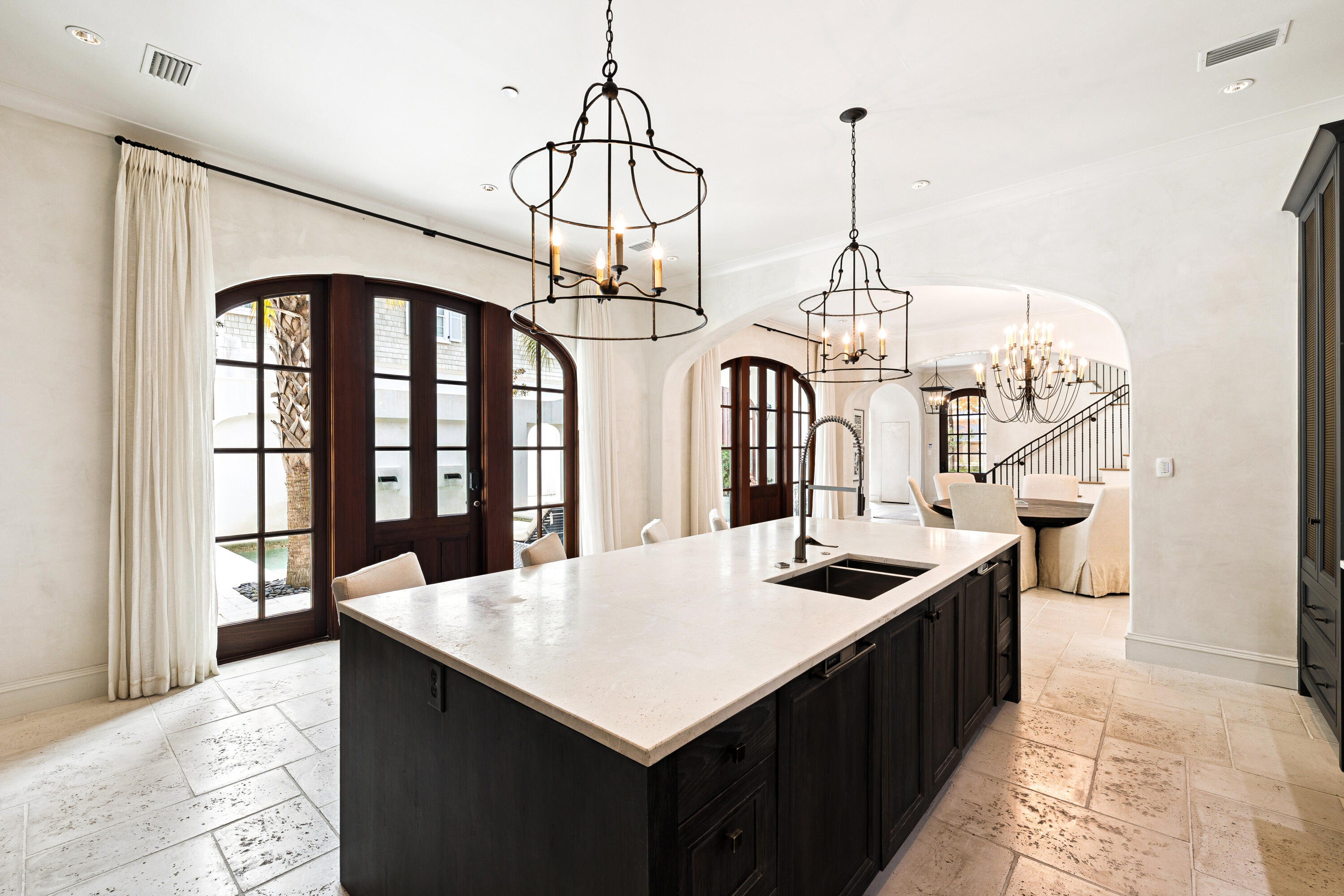 78 West Kingston Road Inlet Beach, FL 32461 - Photo 20 of 75 a kitchen that has a kitchen island a stove a table and chairs in it
