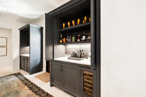 a spacious bedroom with a bed and a flat screen tv