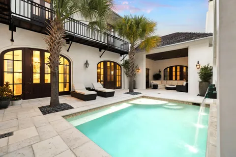 a bathroom with a sink a mirror and shower