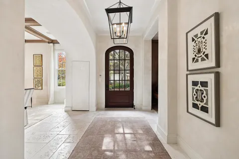 a view of staircase with white walls and a window