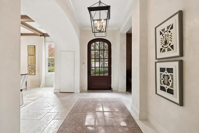 a view of staircase with white walls and a window