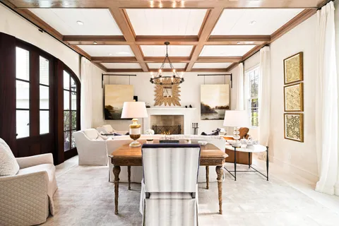 a view of a dining room with furniture and windows