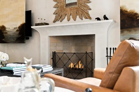 a view of a dining room with furniture and a chandelier