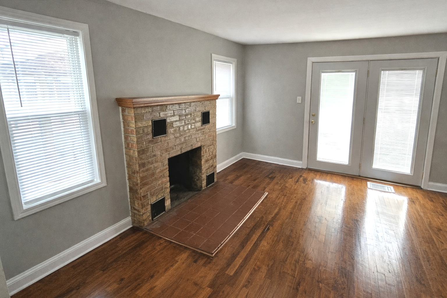 36107 North Green Bay Road Waukegan, IL 60087 - Photo 3 of 17 an empty room with wooden floor and windows