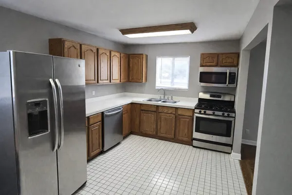 a kitchen with stainless steel appliances granite countertop a refrigerator stove and sink
