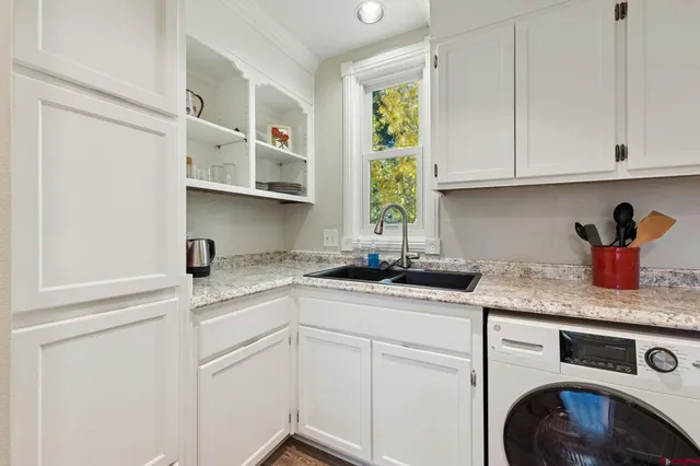 a kitchen with stainless steel appliances granite countertop a refrigerator and a stove