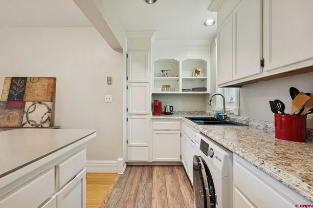 a kitchen with a sink and a stove