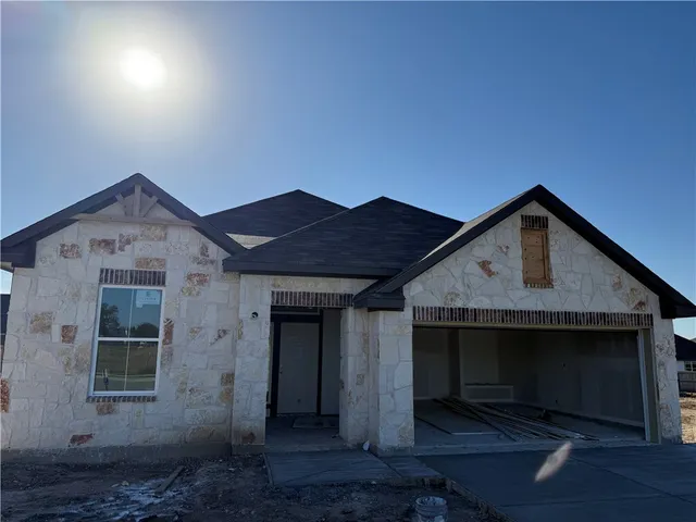 a front view of a house with yard