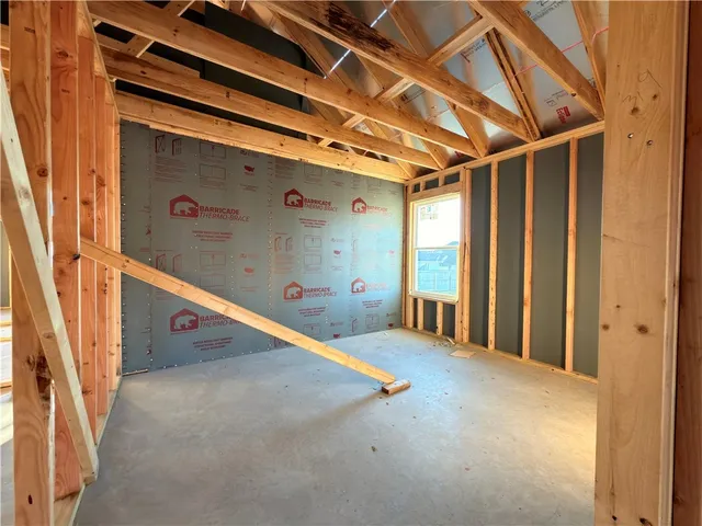 a view of an empty room with windows