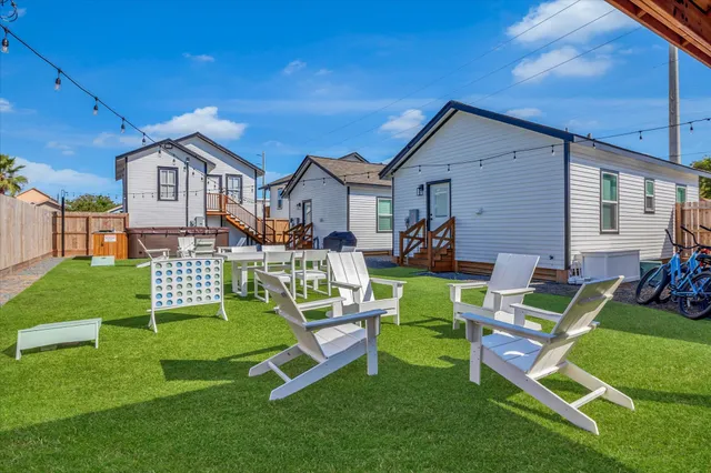 an aerial view of a houses with a yard