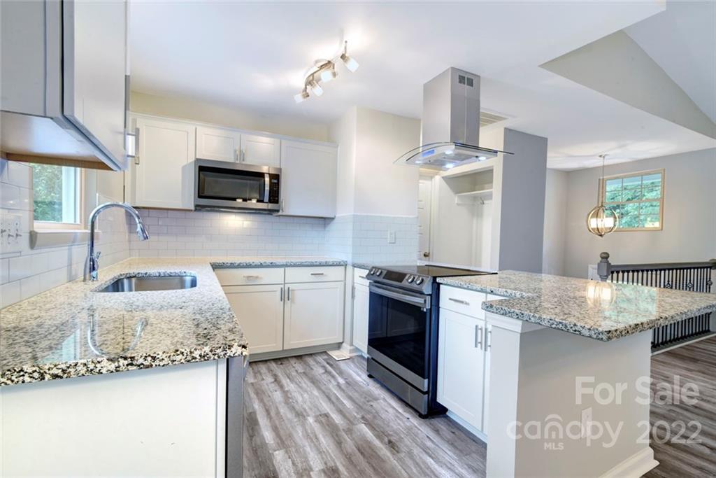 6401 Piney Path Road Charlotte, NC 28212 - Photo 1 of 19 a kitchen with stainless steel appliances granite countertop a sink stove and refrigerator