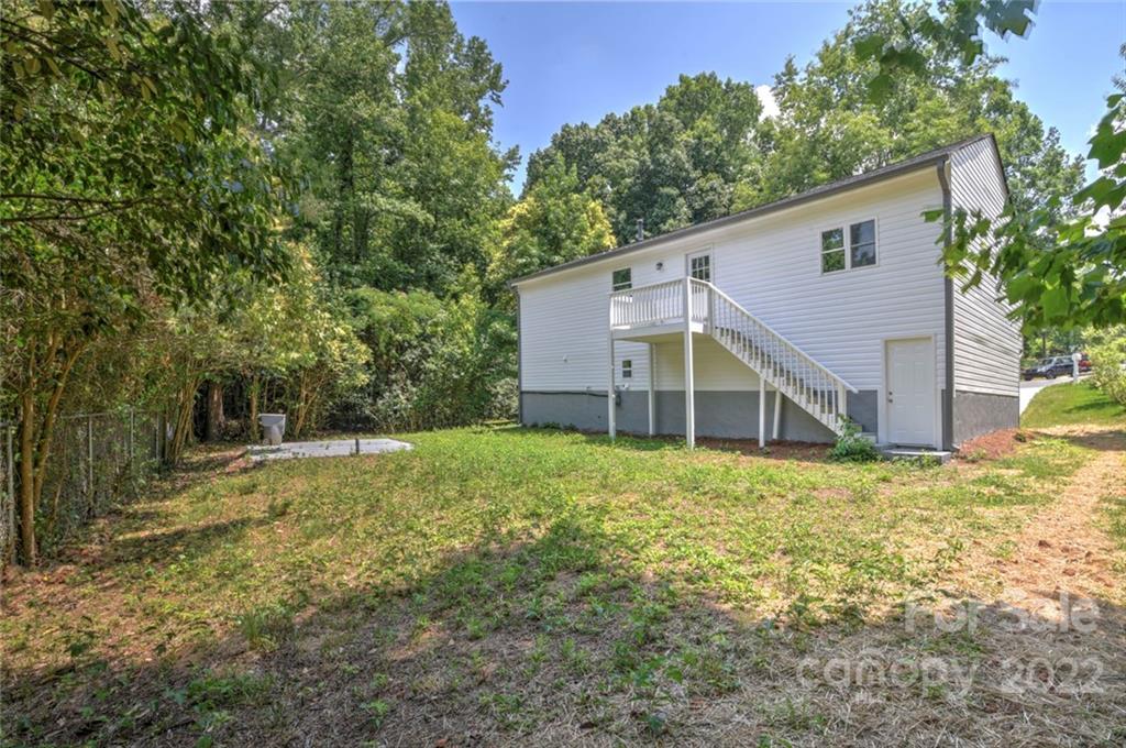 6401 Piney Path Road Charlotte, NC 28212 - Photo 19 of 19 a view of a house with a yard