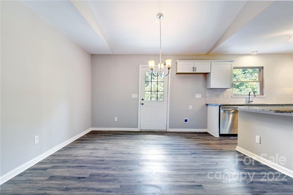 6401 Piney Path Road Charlotte, NC 28212 - Photo 8 of 19 a view of empty room with wooden floor and window