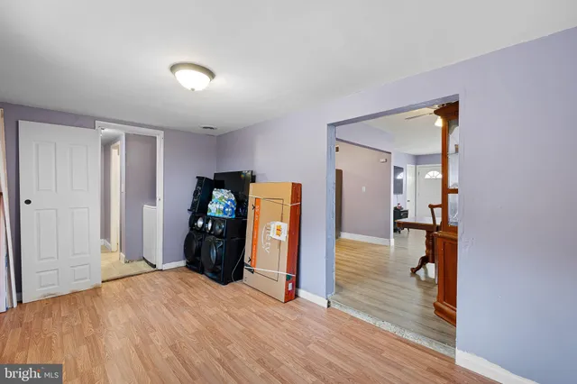 a view of a livingroom with wooden floor and closet