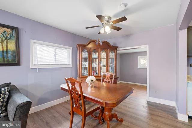 a view of a dining room with furniture and window