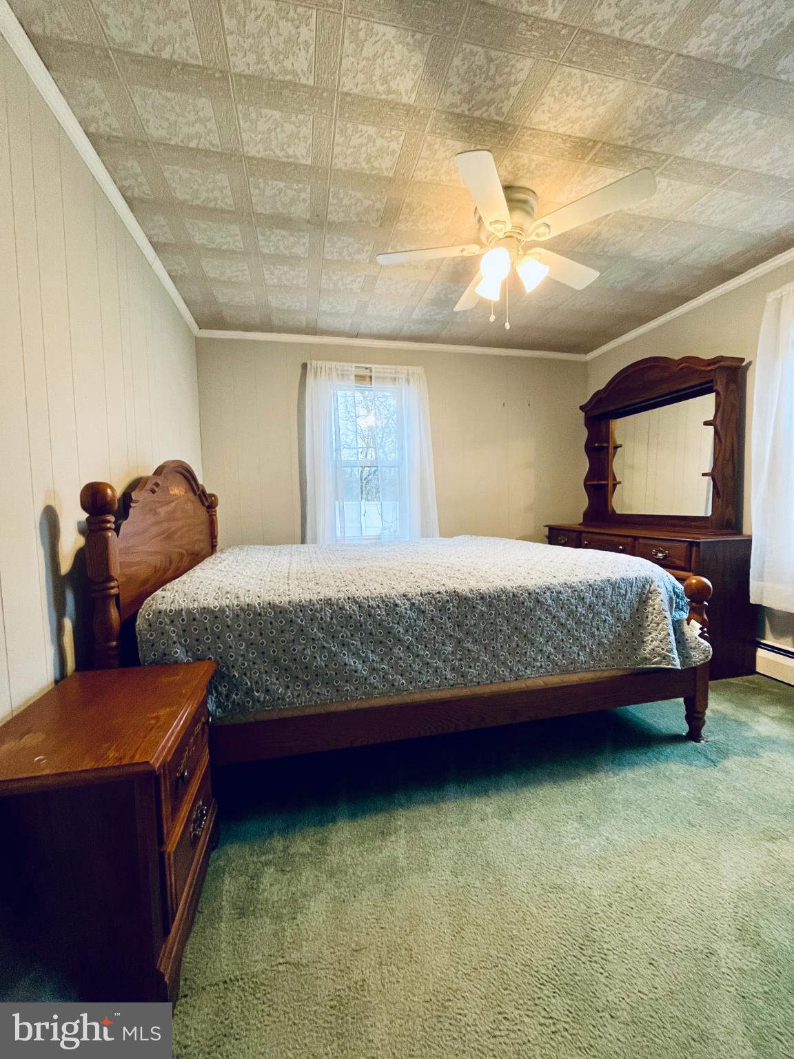 2510 Whiteford Road Whiteford, MD 21160 - Photo 18 of 22 a bedroom with a bed and dresser