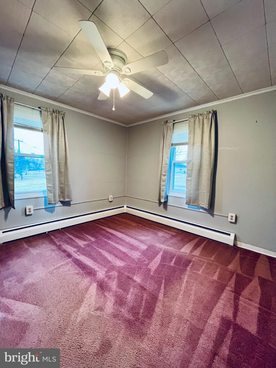 2510 Whiteford Road Whiteford, MD 21160 - Photo 20 of 22 a view of an empty room with window and chandelier fan