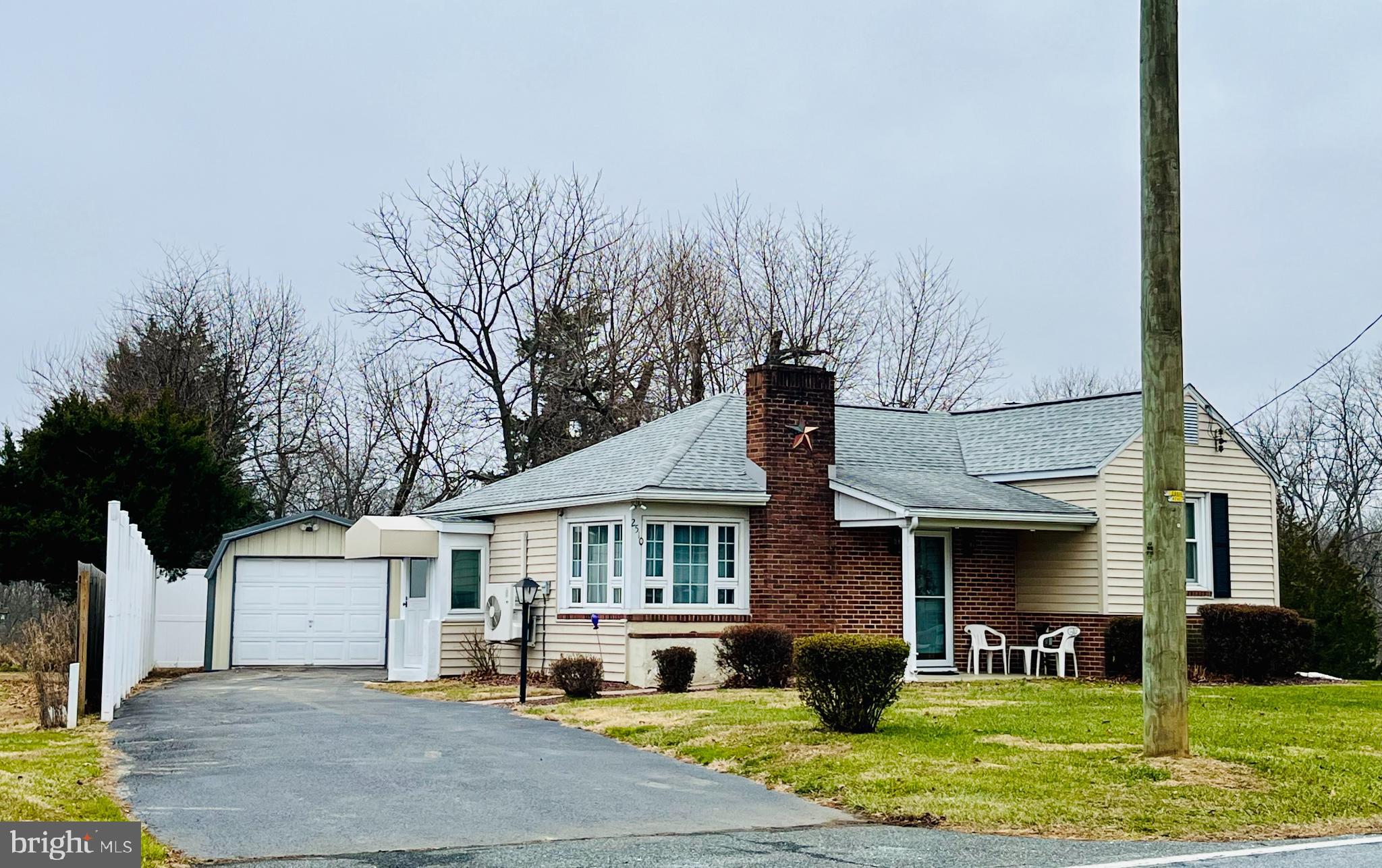 2510 Whiteford Road Whiteford, MD 21160 - Photo 2 of 22 a front view of a house with a yard table and chairs