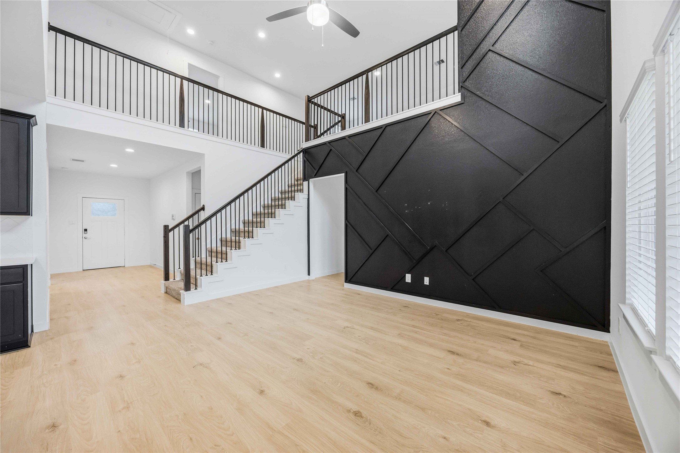 a view of an empty room with stairs
