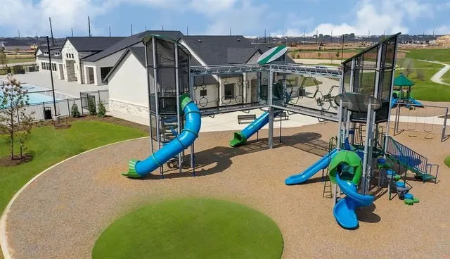 an aerial view of a house with swimming pool