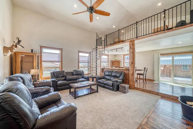 a living room with furniture or couch and a wooden floor