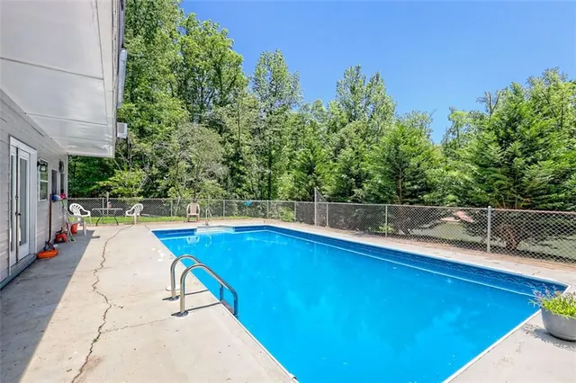 a view of a swimming pool with a patio