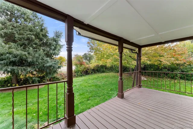 a view of a deck with a yard