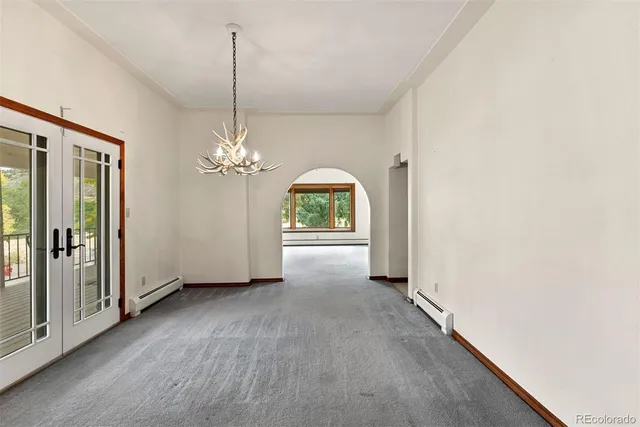 a view of a room with window chandelier